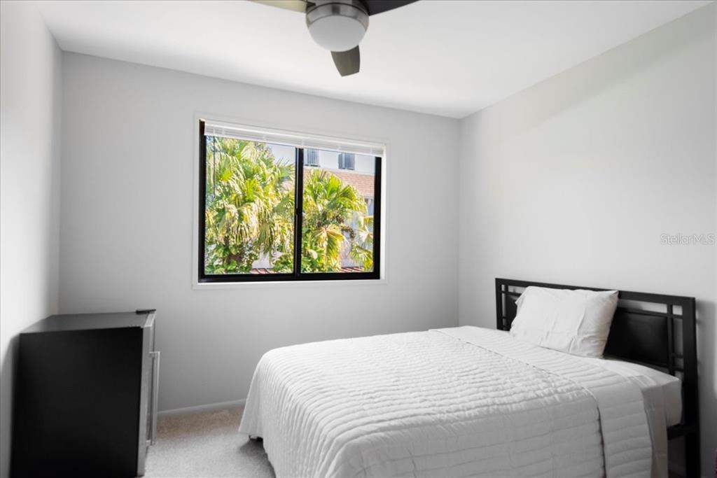 30 Moree Loop, Unit 39 Winter Springs, FL 32708 - Photo 20 of 32 a bedroom with a bed and window