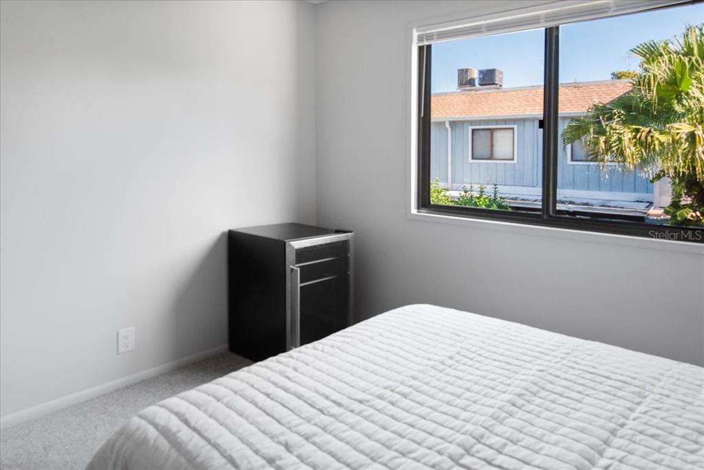 30 Moree Loop, Unit 39 Winter Springs, FL 32708 - Photo 21 of 32 a bedroom with bed and window