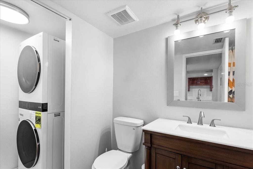 30 Moree Loop, Unit 39 Winter Springs, FL 32708 - Photo 26 of 32 a bathroom with a toilet sink and mirror