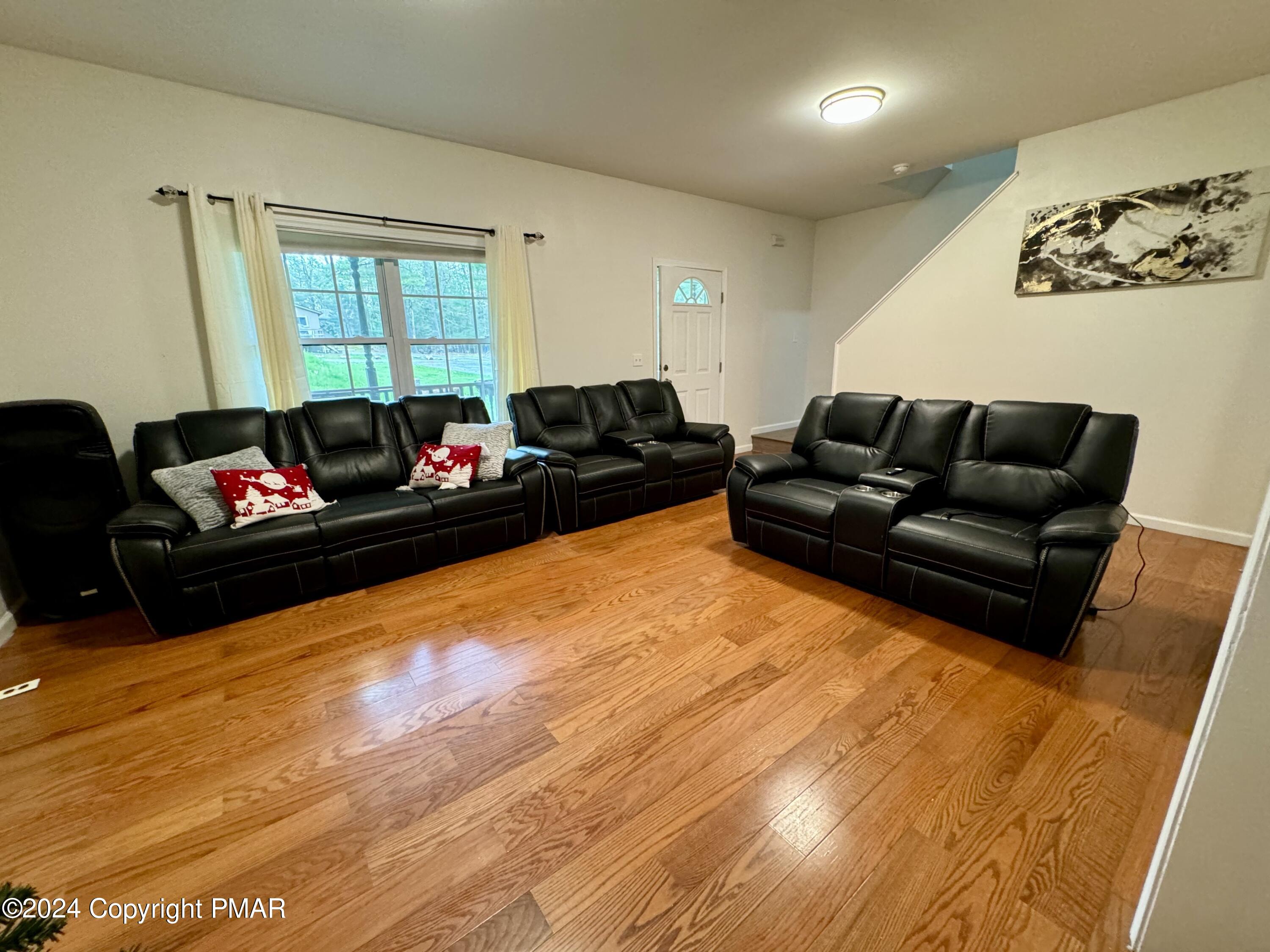 146 Hound Road Dingmans Ferry, PA 18328 - Photo 13 of 50 a living room with furniture window and a flat screen tv