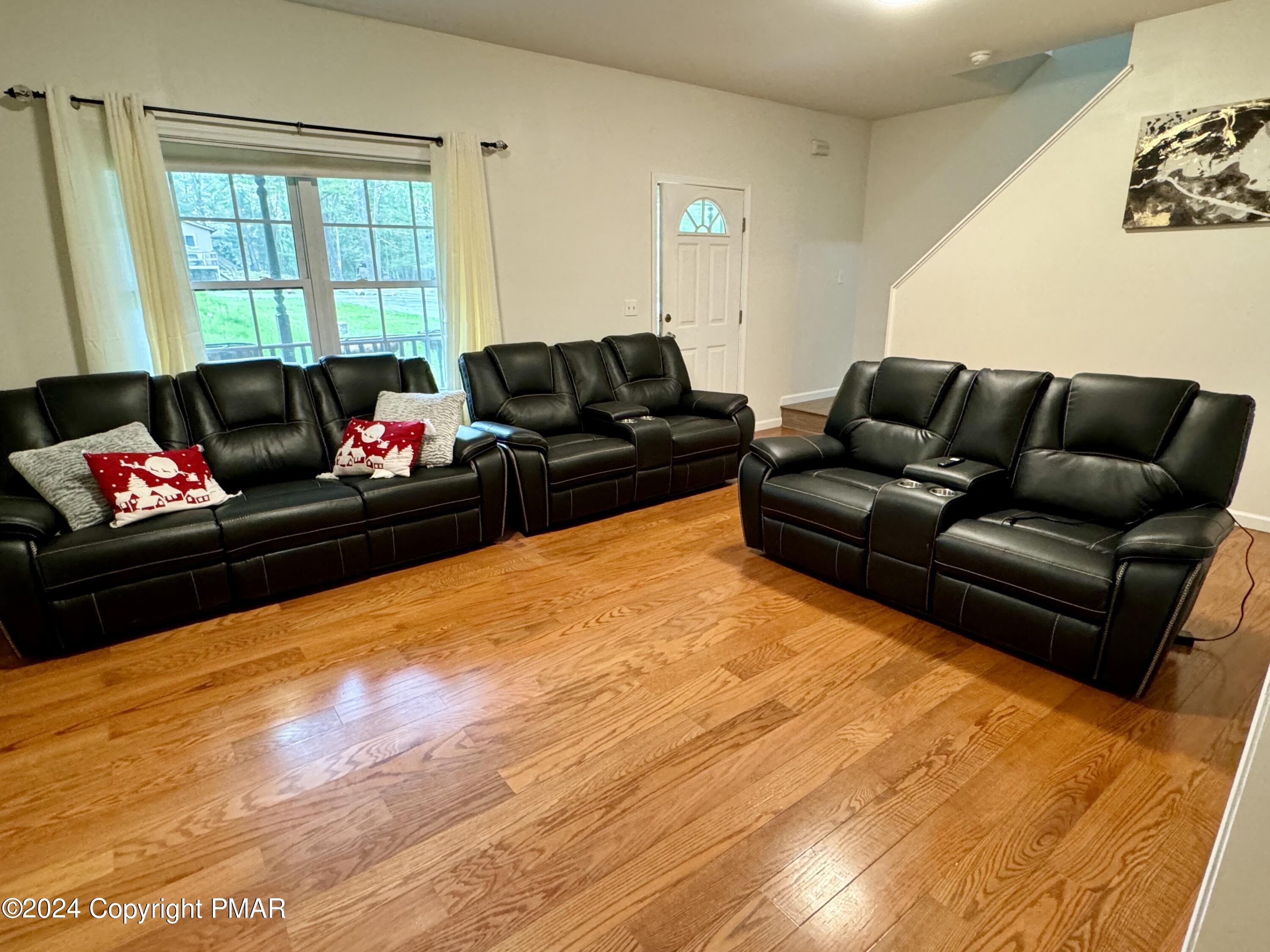 146 Hound Road Dingmans Ferry, PA 18328 - Photo 16 of 50 a living room with furniture and a flat screen tv