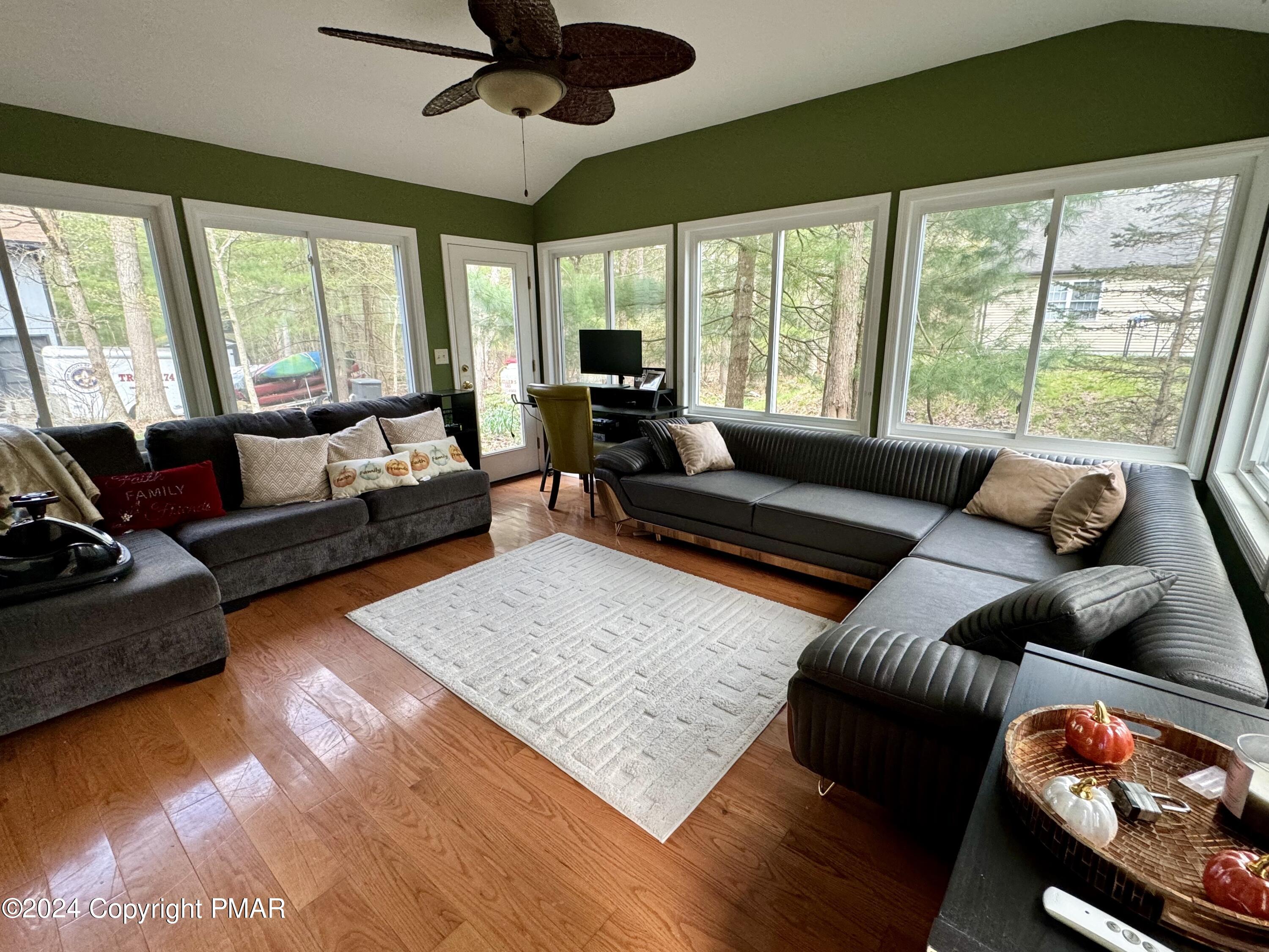 146 Hound Road Dingmans Ferry, PA 18328 - Photo 18 of 50 a living room with furniture and a large window