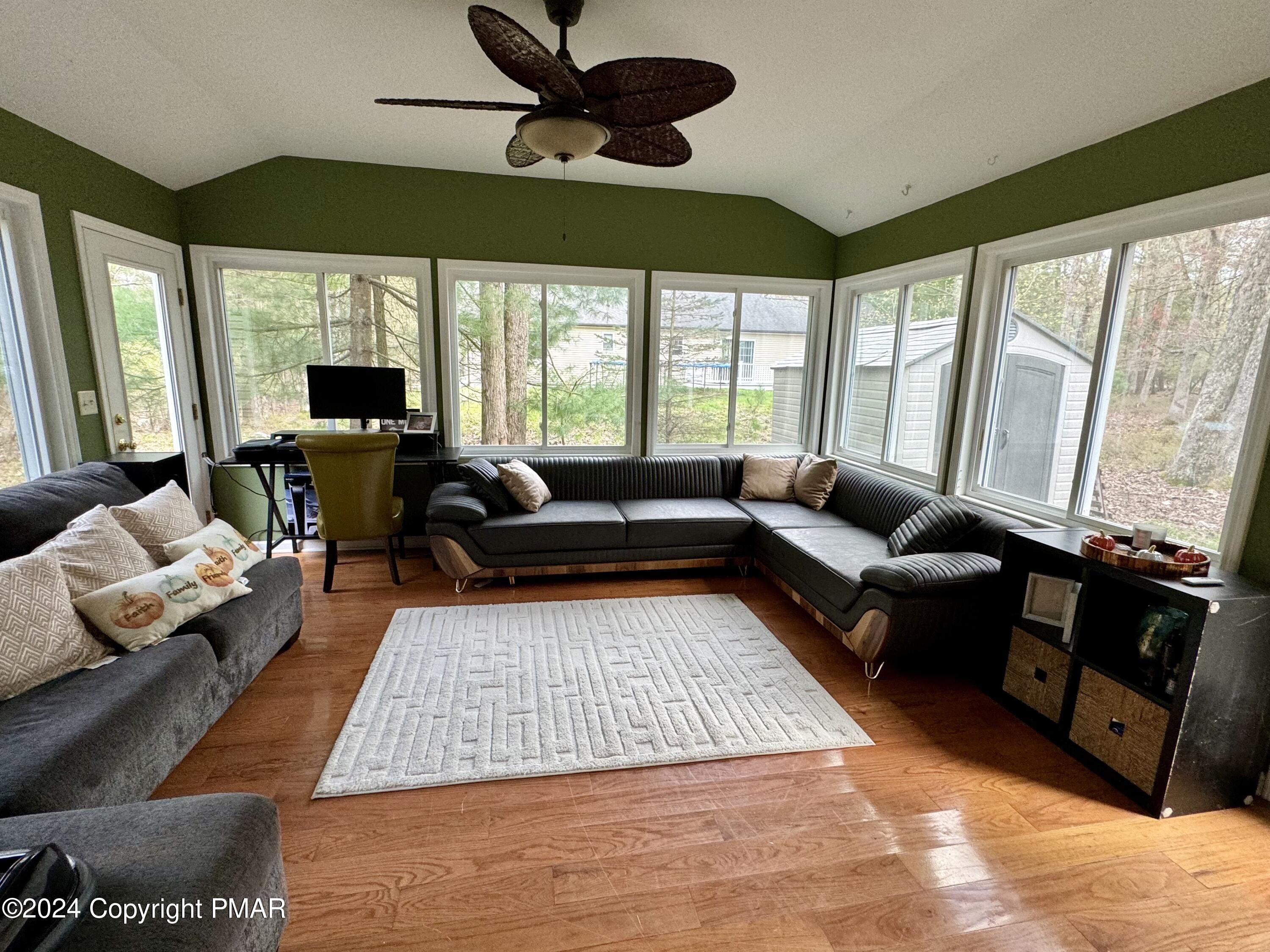 146 Hound Road Dingmans Ferry, PA 18328 - Photo 19 of 50 a living room with furniture and a large window
