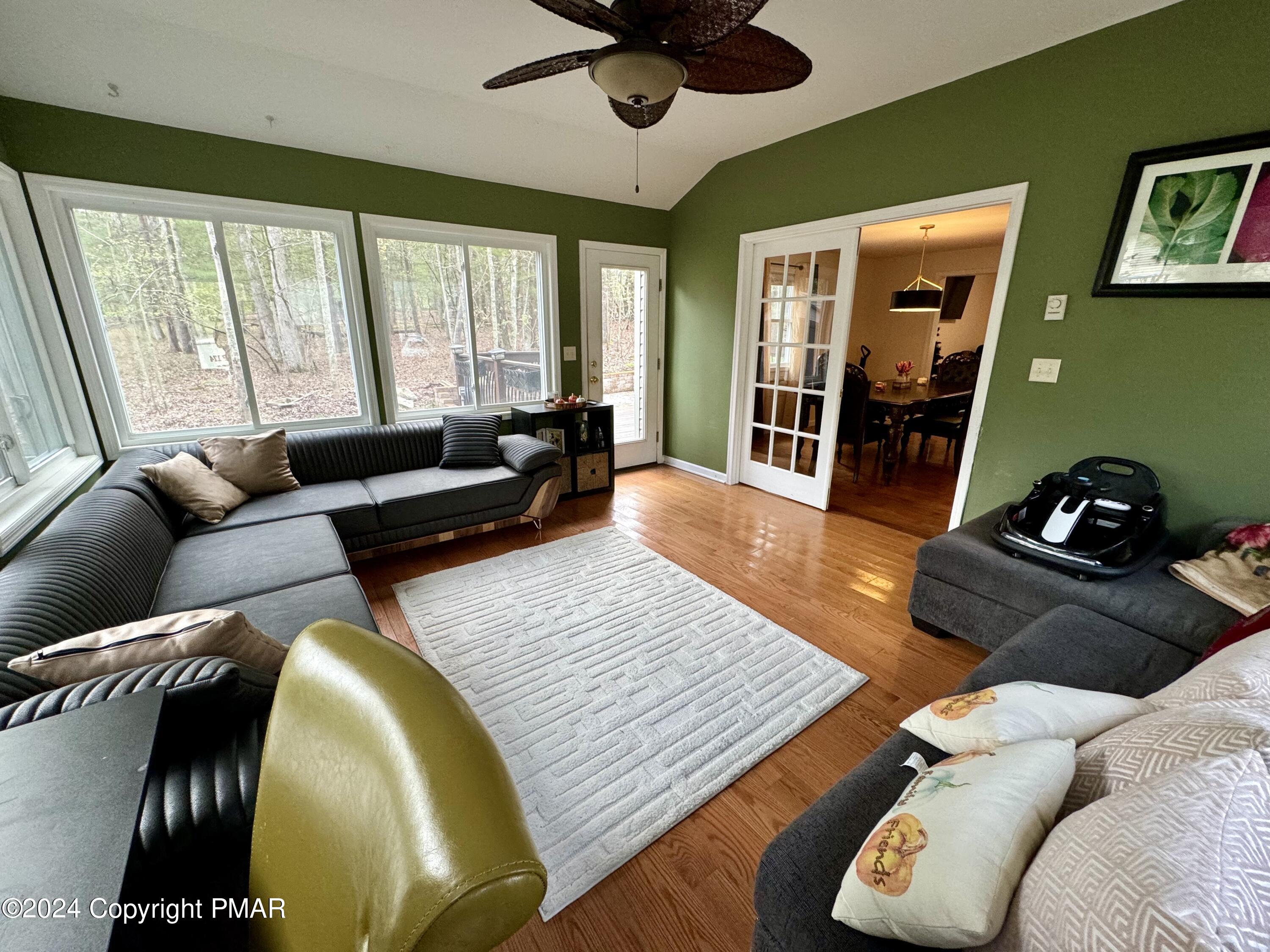 146 Hound Road Dingmans Ferry, PA 18328 - Photo 20 of 50 a living room with furniture and a large window