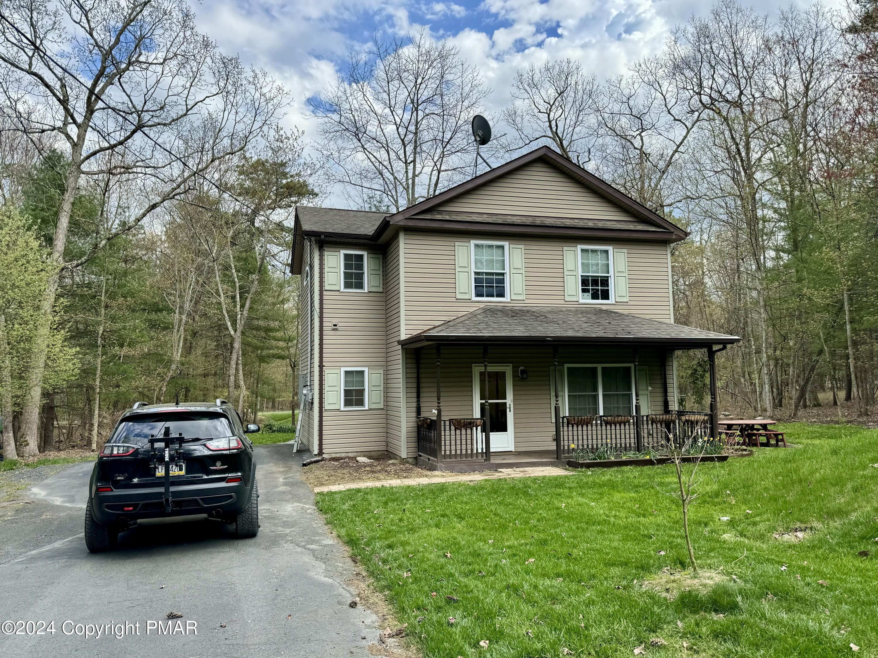 146 Hound Road Dingmans Ferry, PA 18328 - Photo 2 of 50 a view of a car parked in front of a house