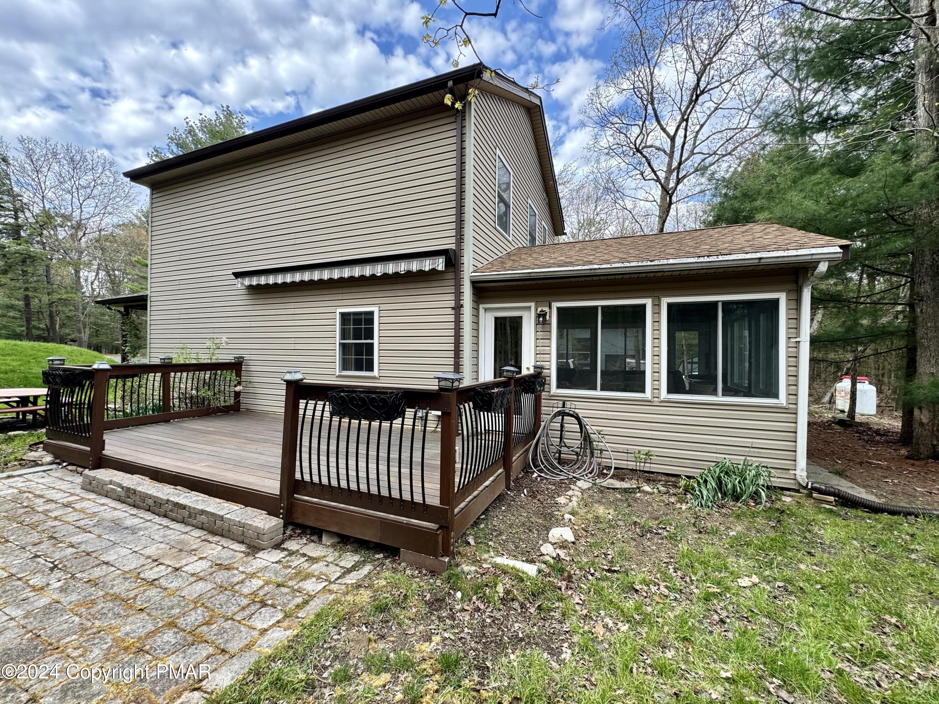 146 Hound Road Dingmans Ferry, PA 18328 - Photo 23 of 50 a front view of a house with garden