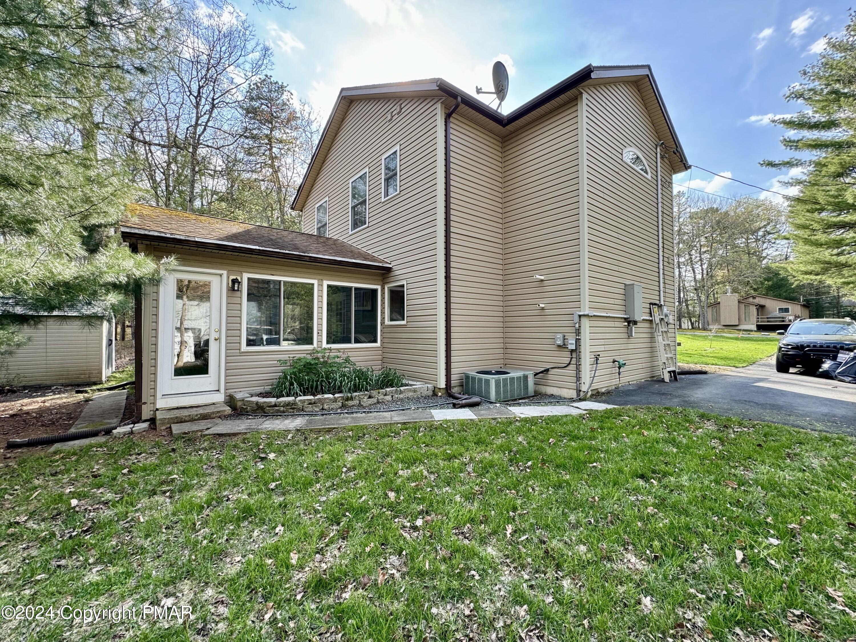 146 Hound Road Dingmans Ferry, PA 18328 - Photo 27 of 50 a front view of house with yard and green space