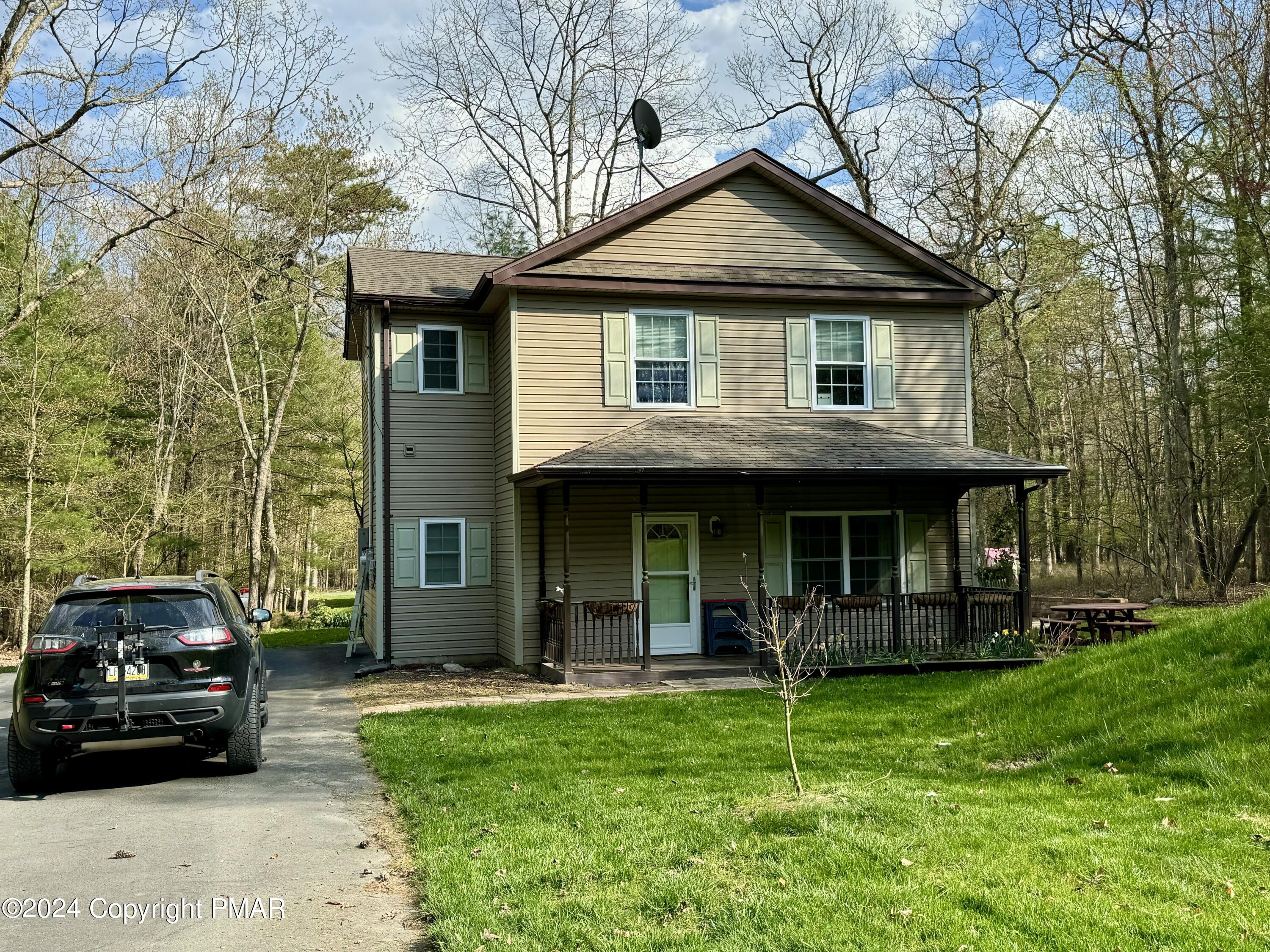 146 Hound Road Dingmans Ferry, PA 18328 - Photo 3 of 50 a view of a car parked in front of a house