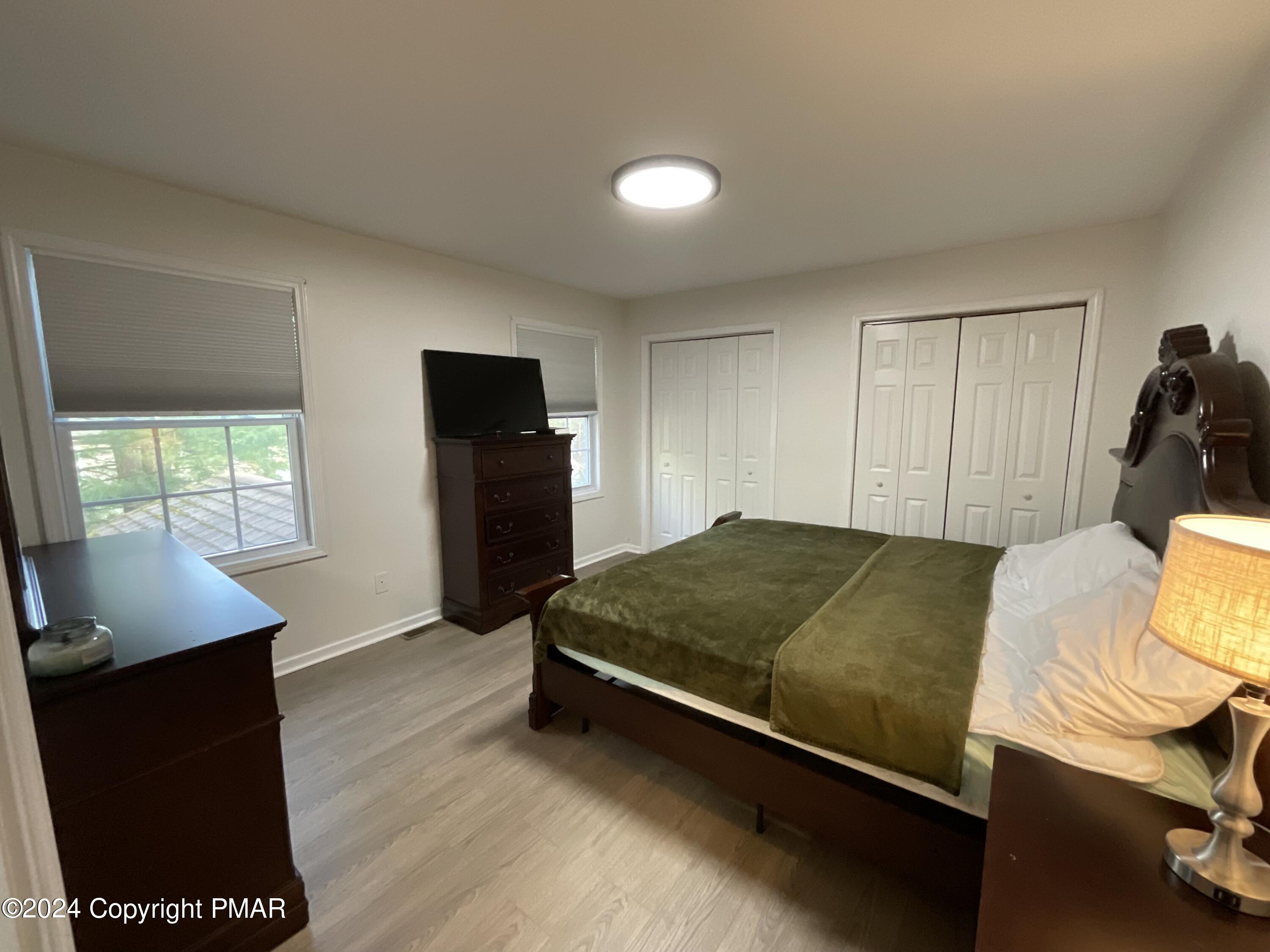 146 Hound Road Dingmans Ferry, PA 18328 - Photo 31 of 50 a bedroom with a bed and a window