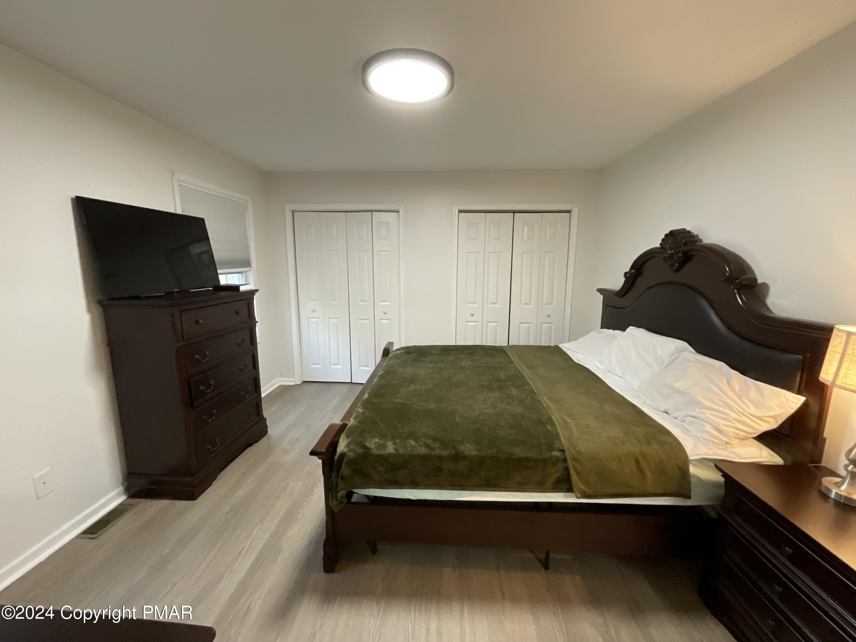 146 Hound Road Dingmans Ferry, PA 18328 - Photo 32 of 50 a bedroom with a bed and two dressers