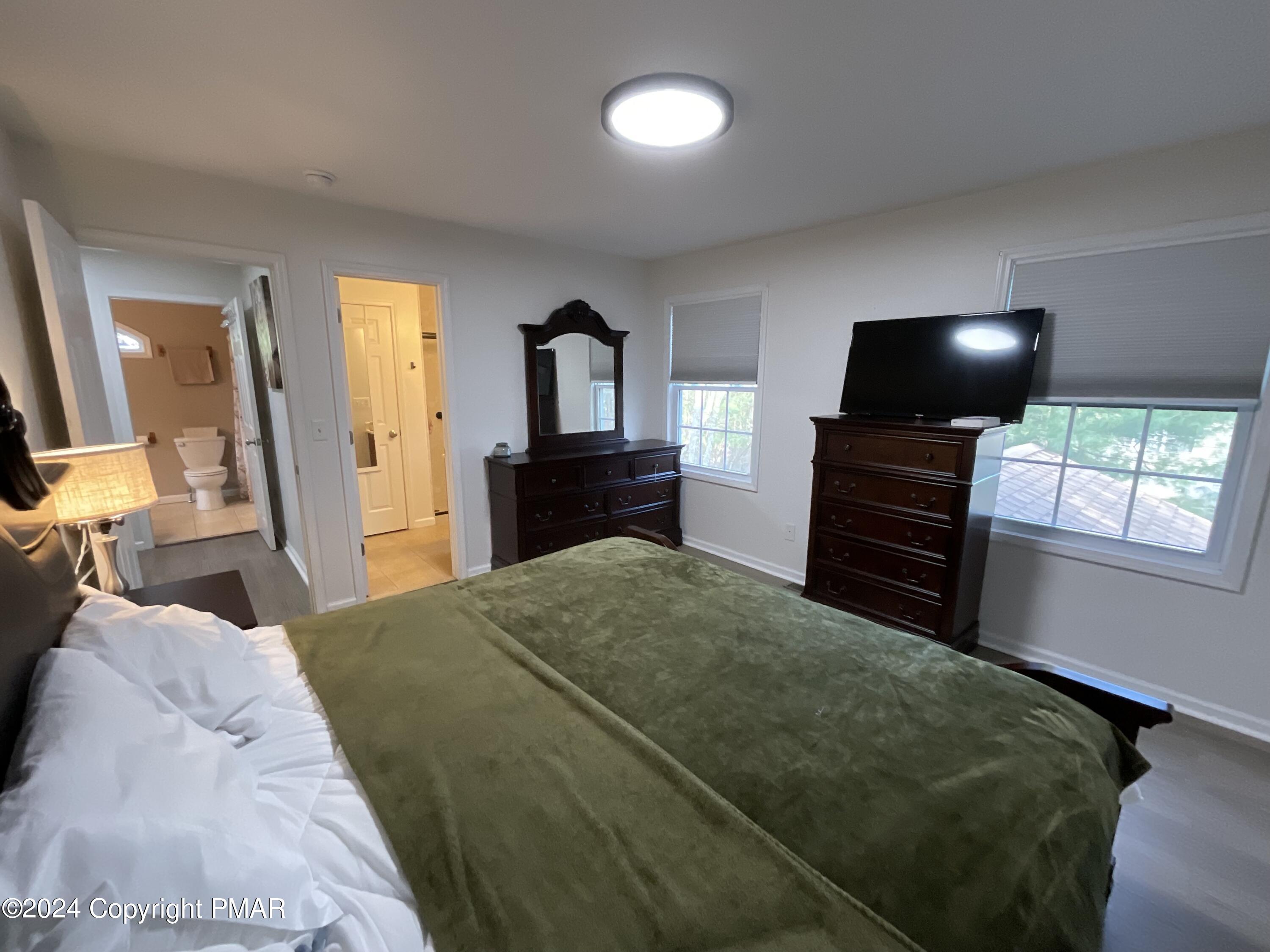 146 Hound Road Dingmans Ferry, PA 18328 - Photo 34 of 50 a bedroom with a bed and a television