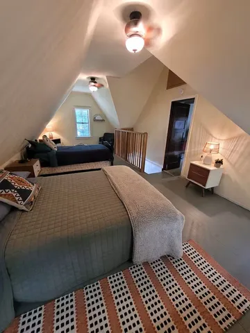 a bedroom with bed and window