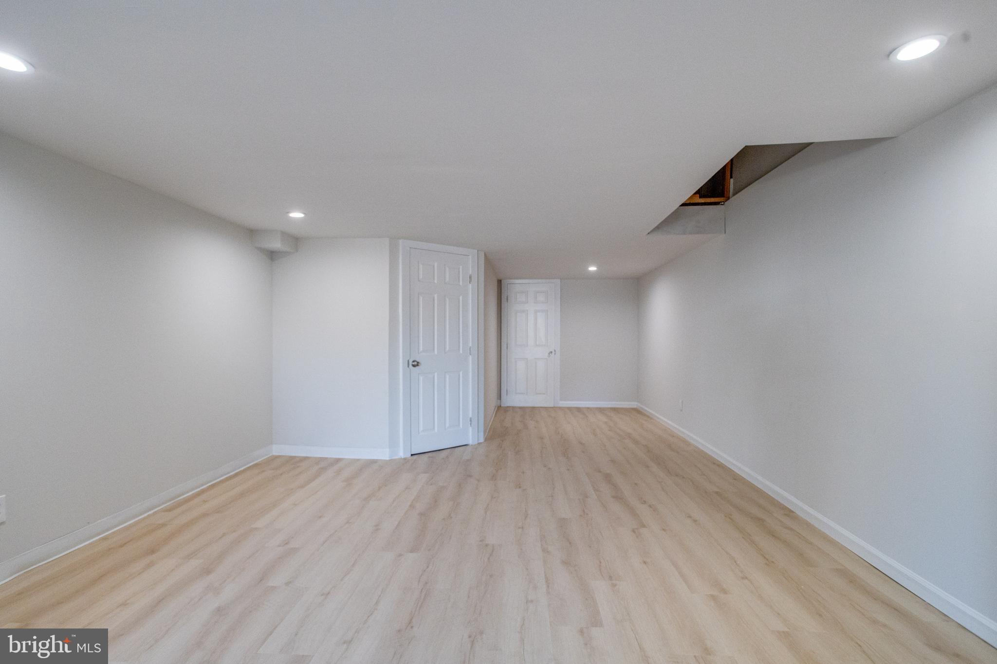 5878 Belair Road Baltimore, MD 21206 - Photo 32 of 41 a view of an empty room with wooden floor
