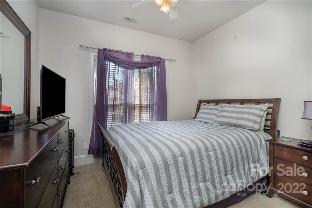 2738 Reservation Road Rock Hill, SC 29730 - Photo 11 of 28 a bedroom with a bed and a flat tv screen on dresser