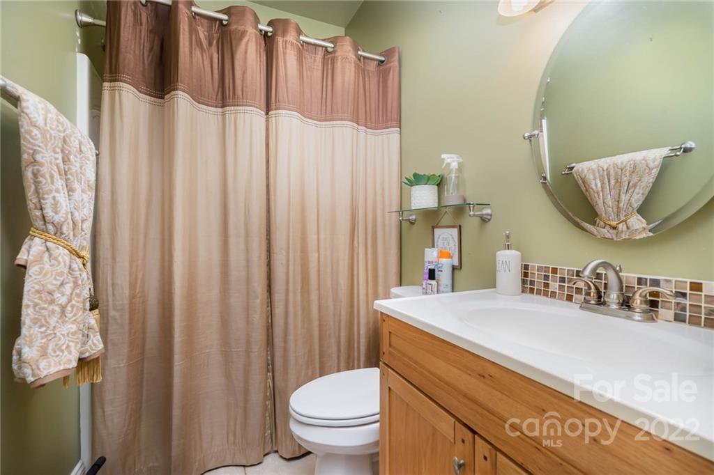 2738 Reservation Road Rock Hill, SC 29730 - Photo 12 of 28 a bathroom with a sink a toilet and shower curtain
