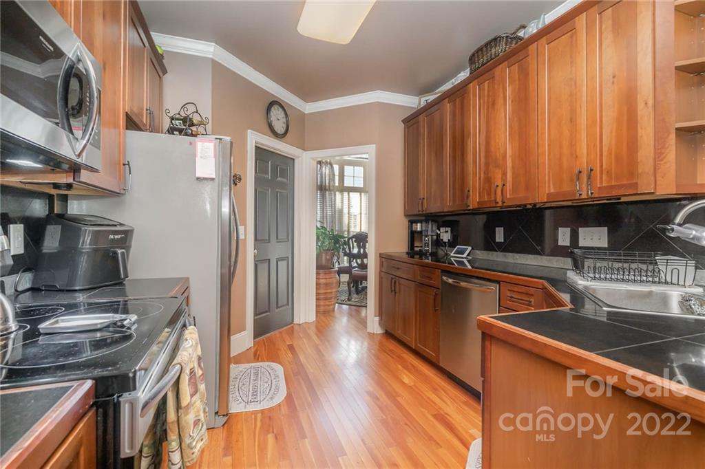 2738 Reservation Road Rock Hill, SC 29730 - Photo 15 of 28 a kitchen with stainless steel appliances granite countertop a stove a sink dishwasher and a refrigerator