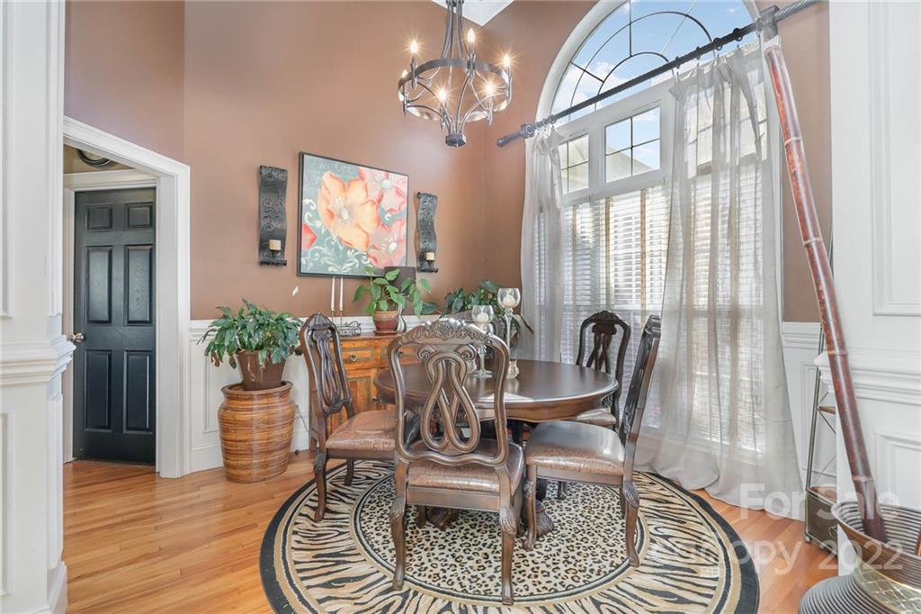 2738 Reservation Road Rock Hill, SC 29730 - Photo 19 of 28 a view of a dining room with furniture wooden floor and a chandelier