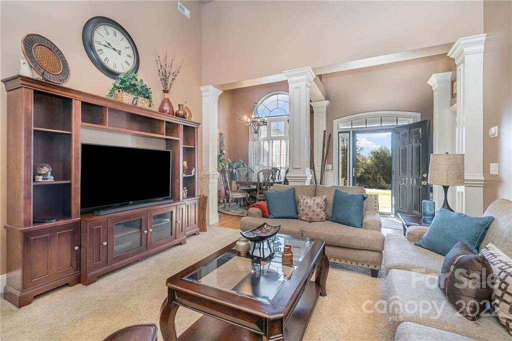 2738 Reservation Road Rock Hill, SC 29730 - Photo 21 of 28 a living room with furniture a flat screen tv and a large window