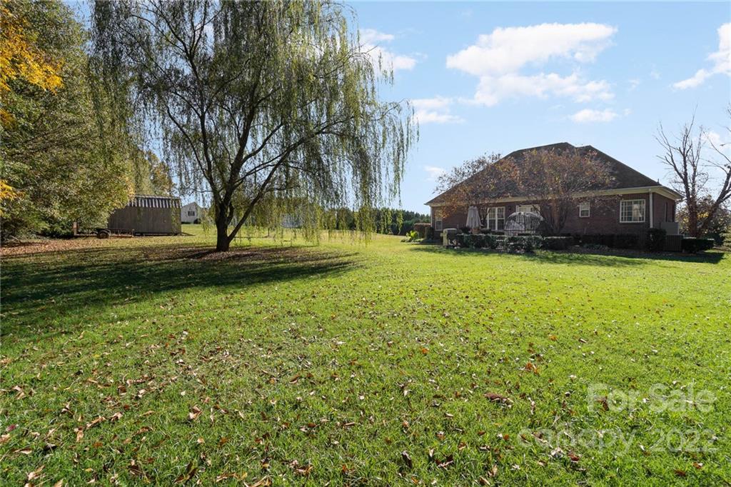 2738 Reservation Road Rock Hill, SC 29730 - Photo 24 of 28 a view of a patio with table and chairs under an umbrella