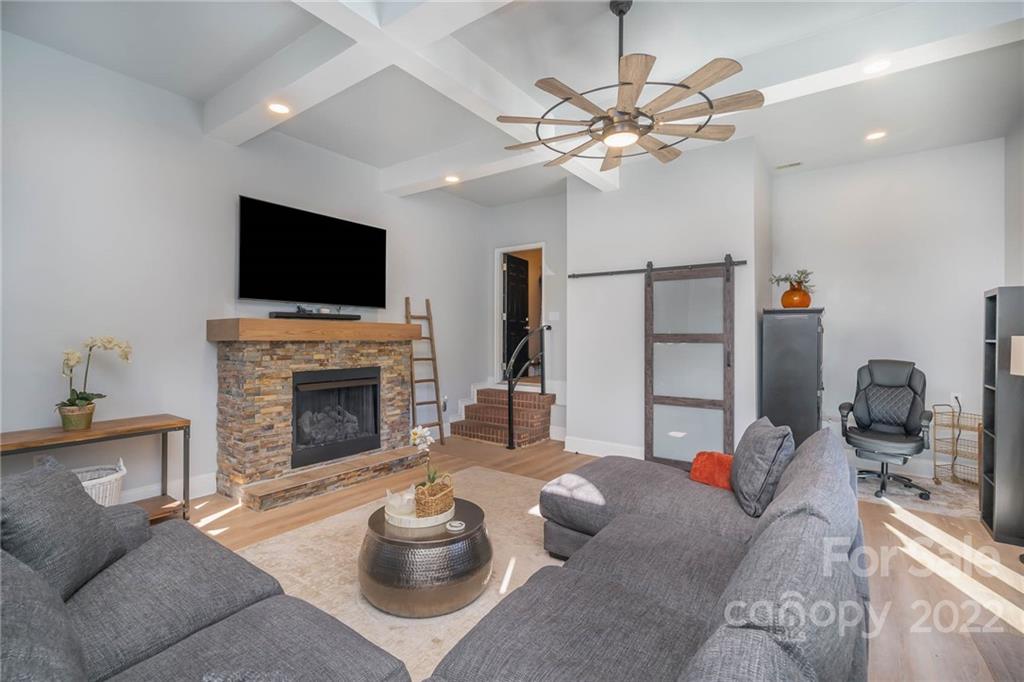 2738 Reservation Road Rock Hill, SC 29730 - Photo 3 of 28 a living room with furniture a fireplace and a flat screen tv