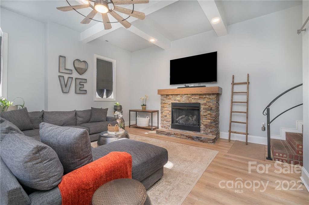 2738 Reservation Road Rock Hill, SC 29730 - Photo 4 of 28 a living room with furniture a flat screen tv and a fireplace