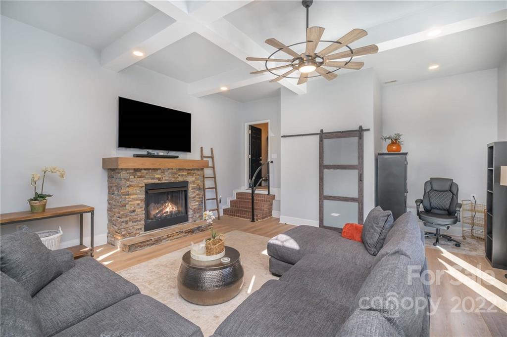 2738 Reservation Road Rock Hill, SC 29730 - Photo 5 of 28 a living room with furniture a fireplace and a flat screen tv