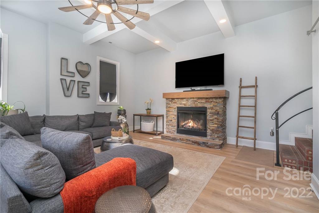 2738 Reservation Road Rock Hill, SC 29730 - Photo 6 of 28 a living room with furniture a flat screen tv and a fireplace