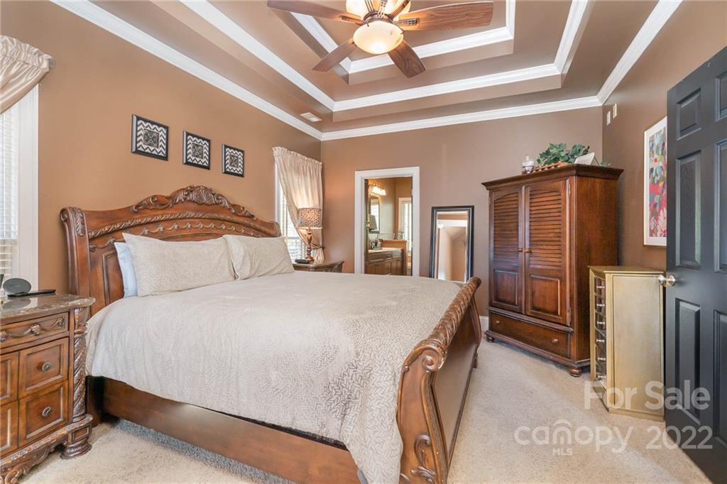 2738 Reservation Road Rock Hill, SC 29730 - Photo 8 of 28 a spacious bedroom with a bed table and a flat tv screen