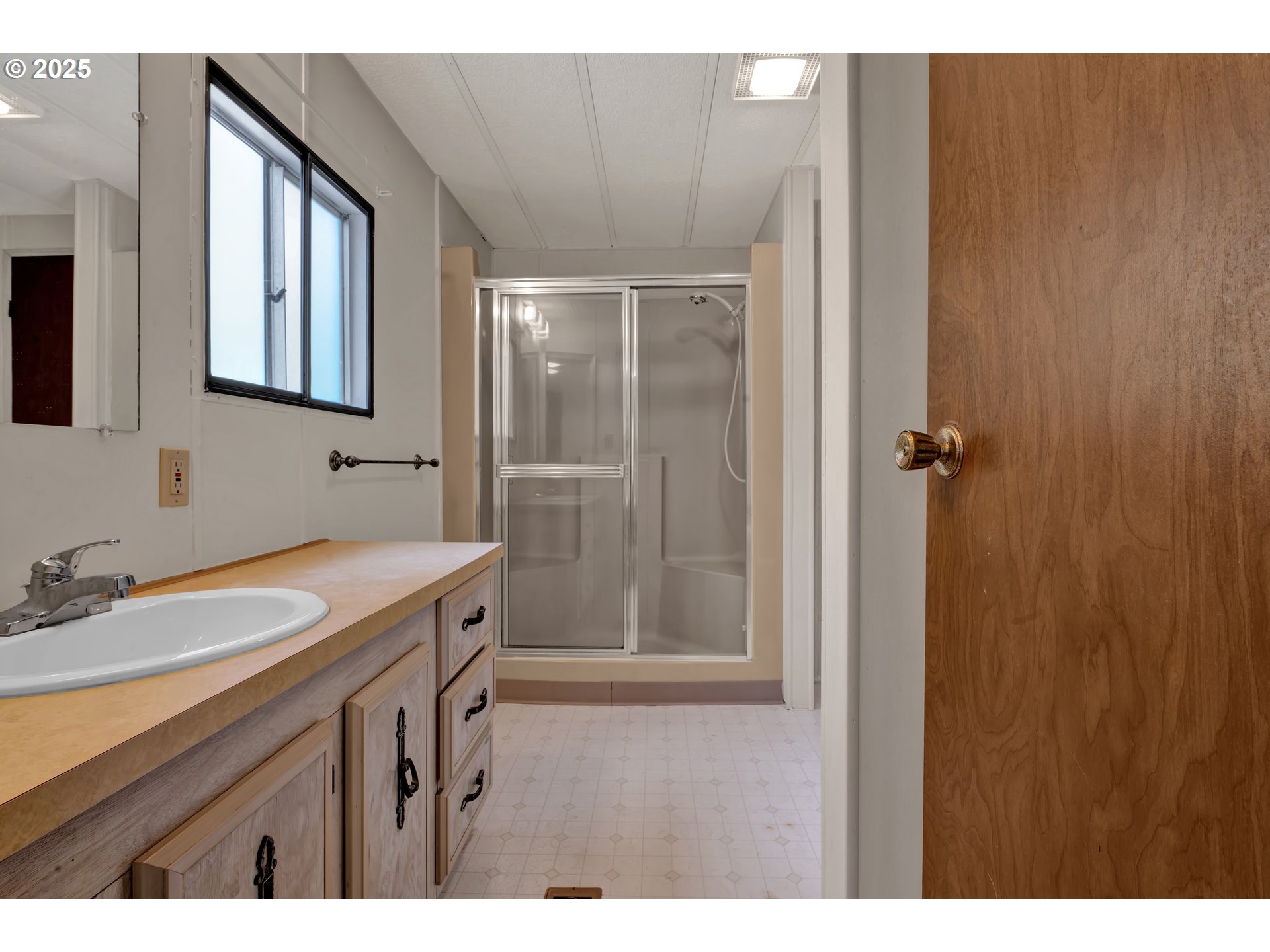 5419 Friendly Acres Road Florence, OR 97439 - Photo 15 of 18 a bathroom with a granite countertop sink mirror and double