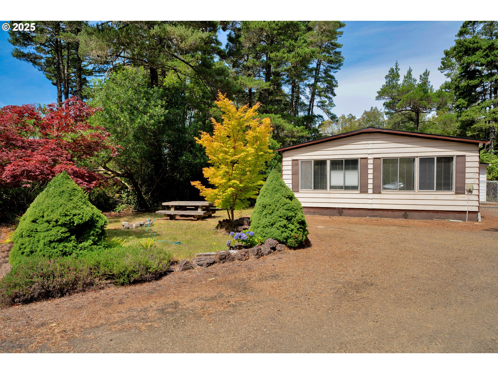 5419 Friendly Acres Road Florence, OR 97439 - Photo 4 of 18 a view of a house with a yard