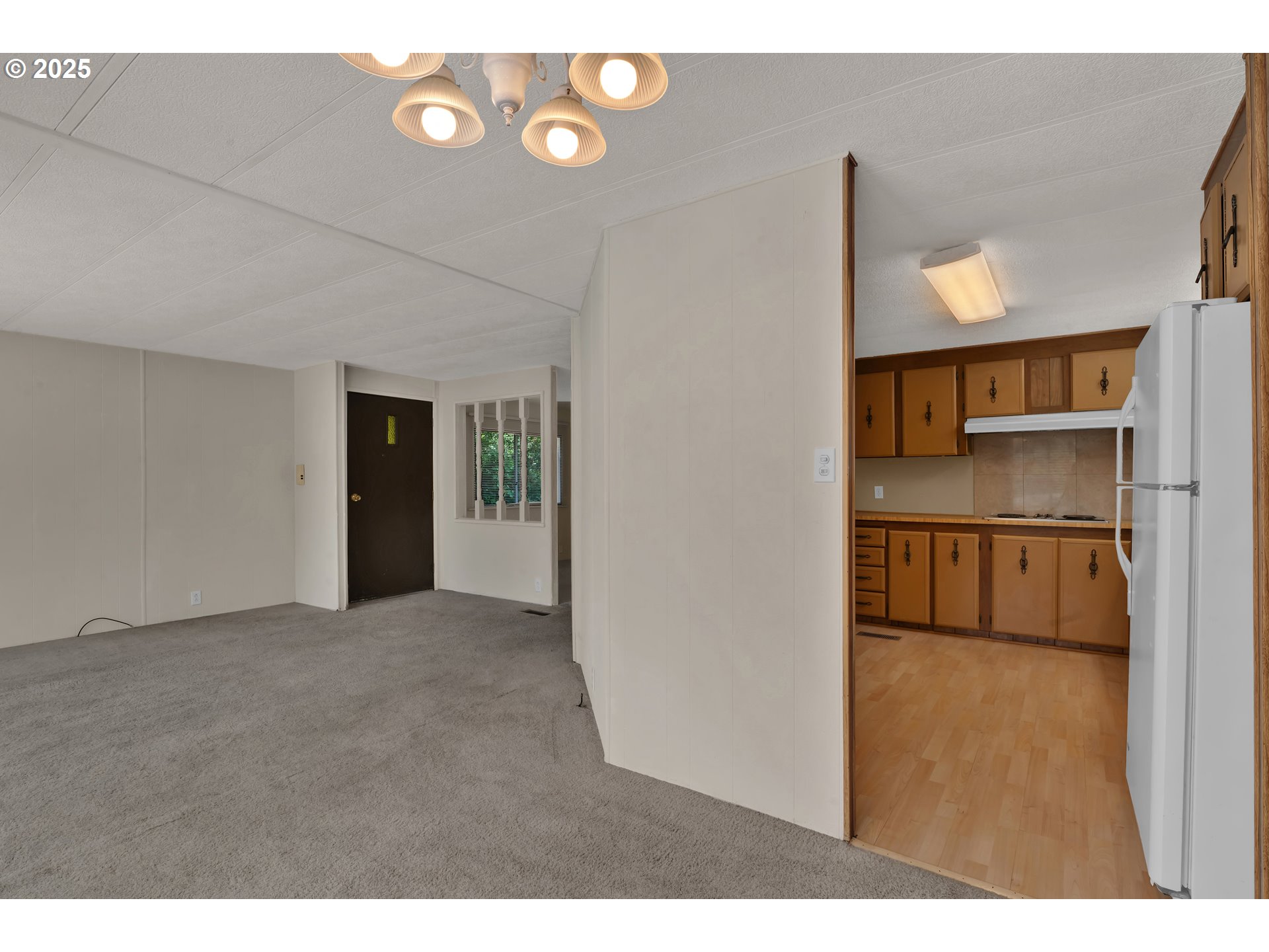 5419 Friendly Acres Road Florence, OR 97439 - Photo 9 of 18 a view of empty room with a fireplace