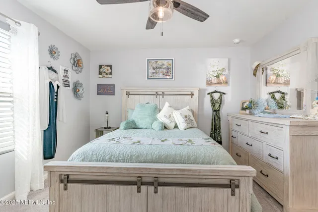 a bedroom with a bed and a dresser