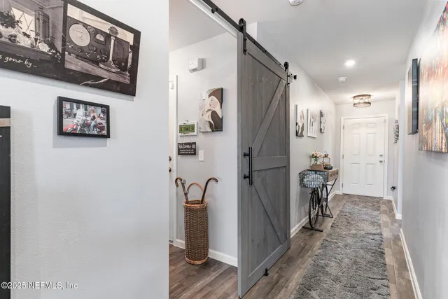 a bathroom with a shower and a glass door
