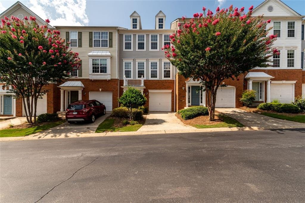 1112 Bendleton Trace Alpharetta, GA 30004 - Photo 1 of 1 a view of a street with houses on both side