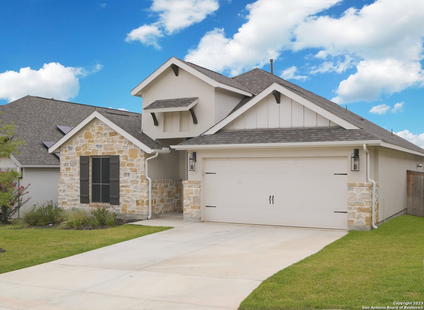1137 Cadogan Squire San Antonio, TX 78260 - Photo 1 of 1 a front view of a house with a yard and garage