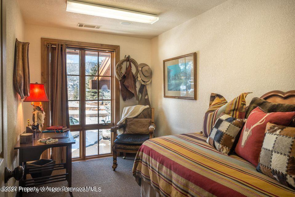 38 Diamond A Ranch Road Carbondale, CO 81623 - Photo 22 of 44 a bedroom with furniture and a window