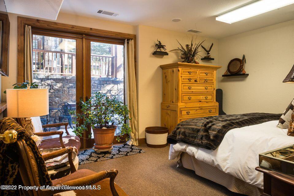 38 Diamond A Ranch Road Carbondale, CO 81623 - Photo 23 of 44 a bedroom with bed and a window