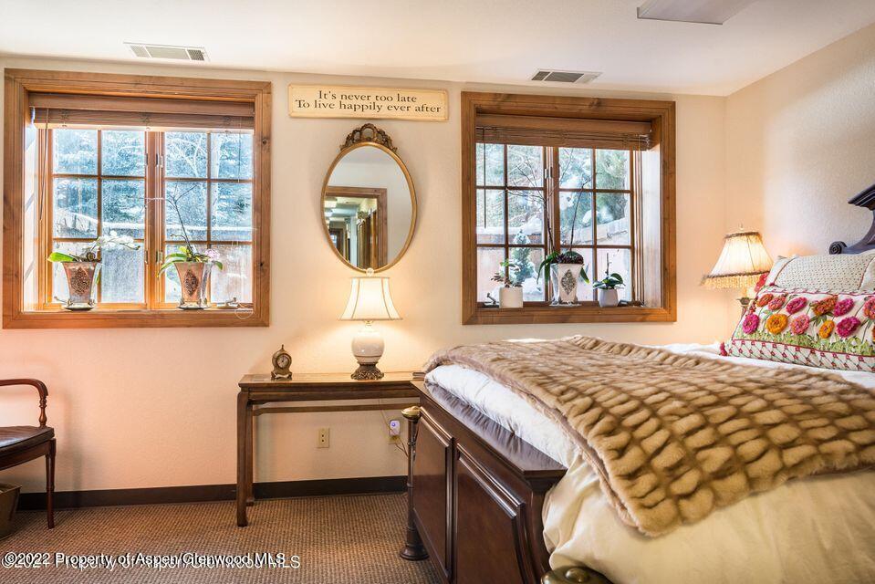 38 Diamond A Ranch Road Carbondale, CO 81623 - Photo 27 of 44 a bedroom with a bed and a window