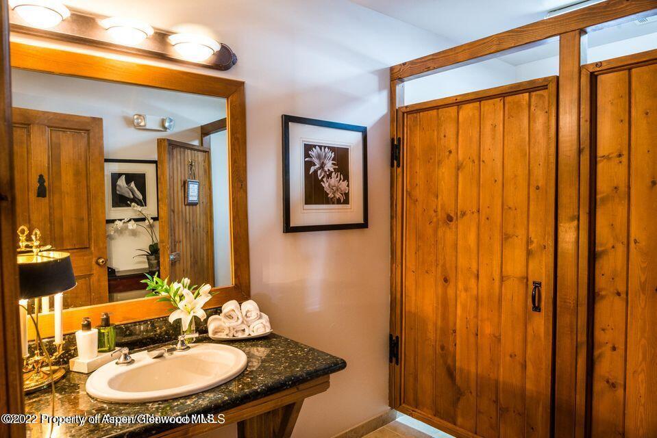 38 Diamond A Ranch Road Carbondale, CO 81623 - Photo 29 of 44 a bathroom with a sink and a mirror