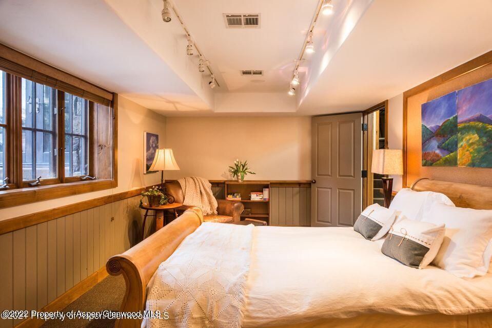 38 Diamond A Ranch Road Carbondale, CO 81623 - Photo 31 of 44 a bedroom with a bed and a large window