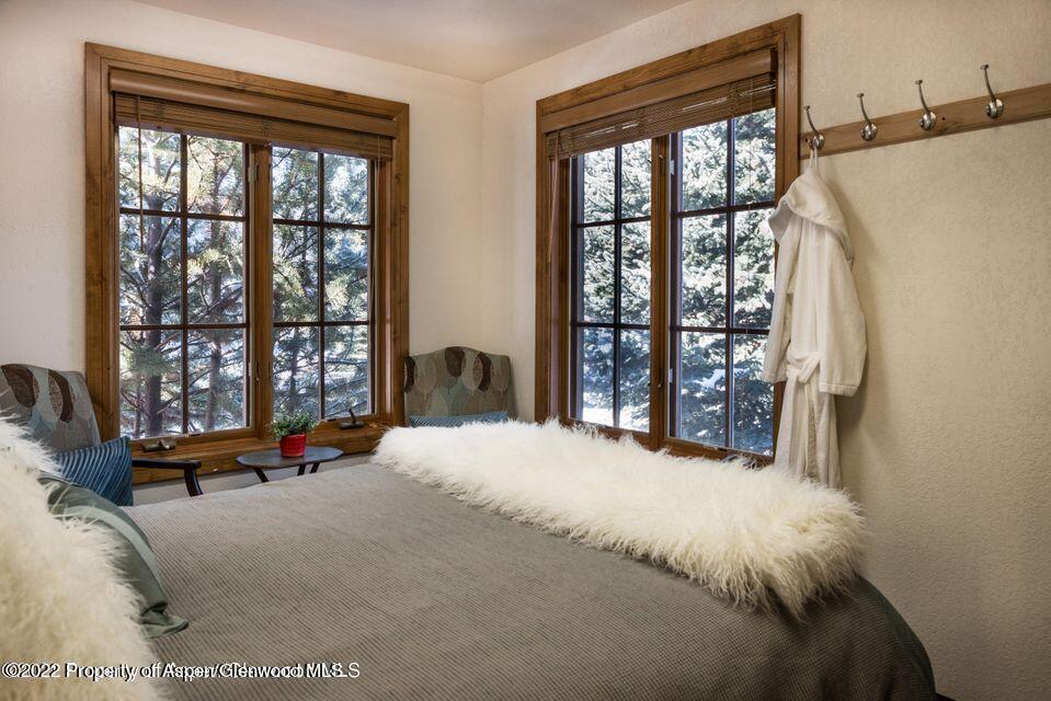38 Diamond A Ranch Road Carbondale, CO 81623 - Photo 35 of 44 a bed sitting in a bedroom next to a window