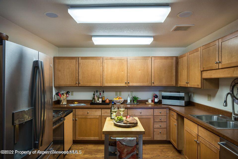 38 Diamond A Ranch Road Carbondale, CO 81623 - Photo 36 of 44 a kitchen with stainless steel appliances granite countertop a refrigerator a sink a stove and cabinets