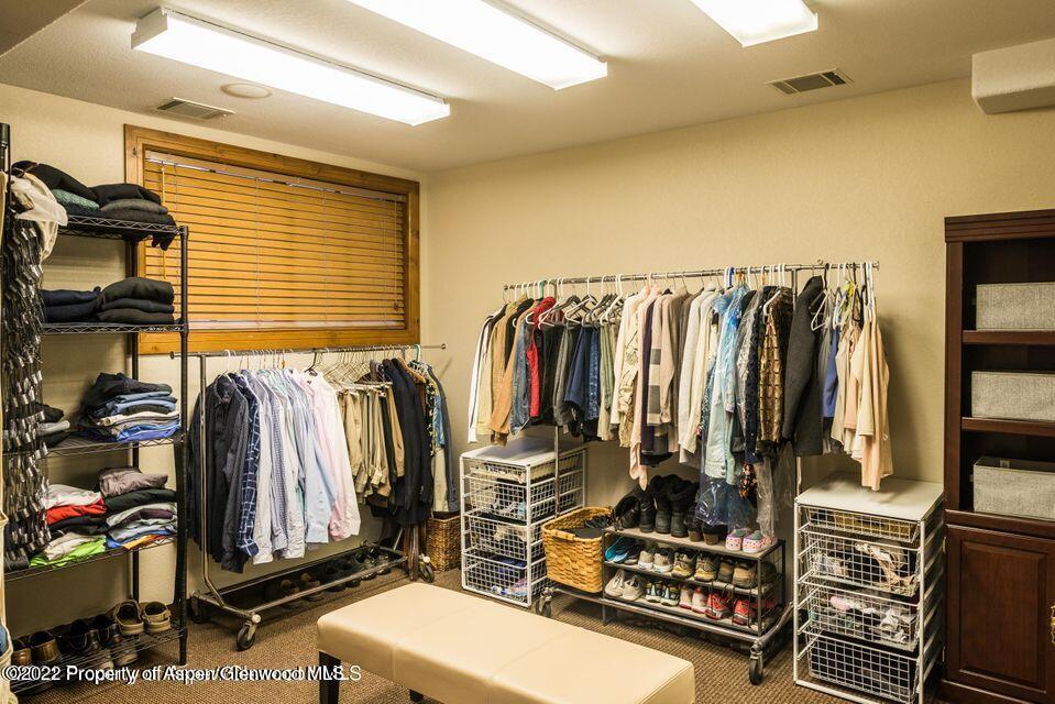 38 Diamond A Ranch Road Carbondale, CO 81623 - Photo 42 of 44 a view of walk in closet with clothes and shoes