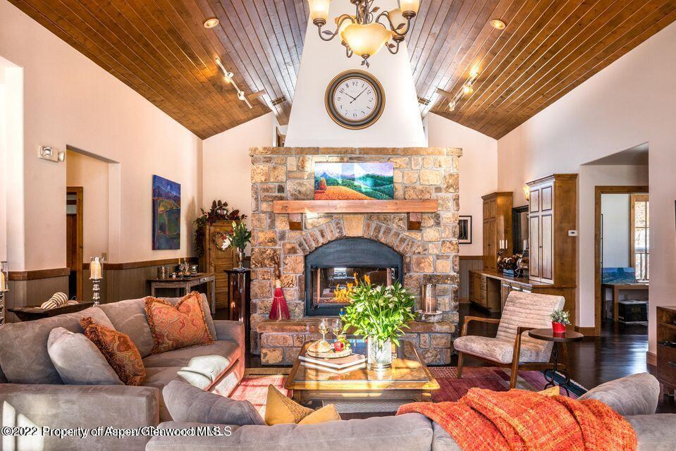 38 Diamond A Ranch Road Carbondale, CO 81623 - Photo 9 of 44 a living room with furniture a fireplace and a large window