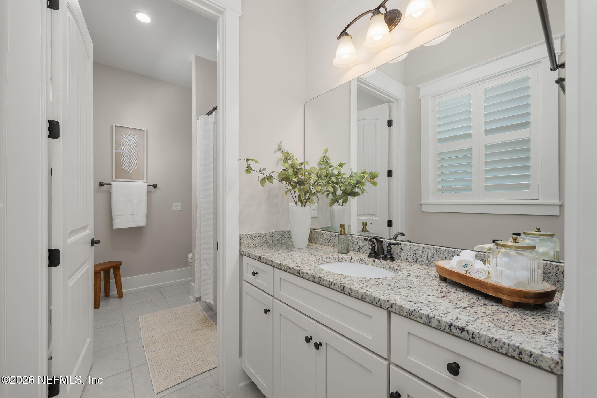 599 Timber Bridge Lane Atlantic Beach, FL 32233 - Photo 24 of 60 a bathroom with a granite countertop sink and a mirror