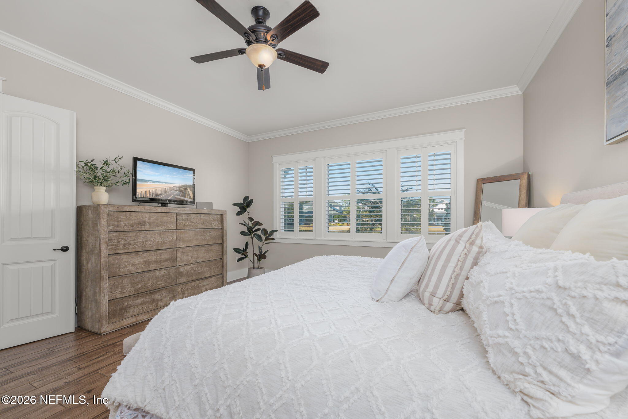 599 Timber Bridge Lane Atlantic Beach, FL 32233 - Photo 37 of 60 a bedroom with a bed and a flat screen tv