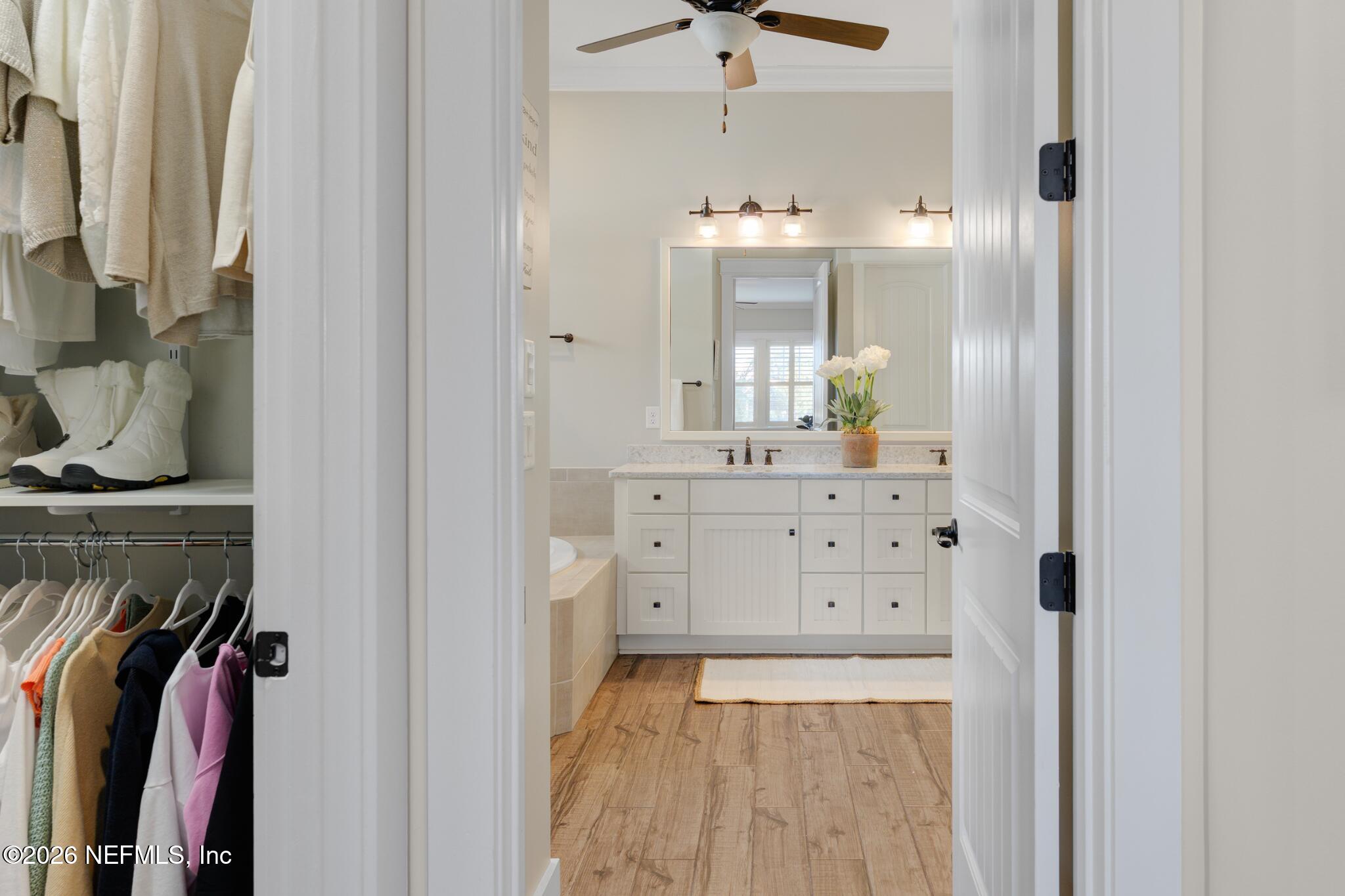 599 Timber Bridge Lane Atlantic Beach, FL 32233 - Photo 38 of 60 a spacious bathroom with a double vanity sink and a mirror
