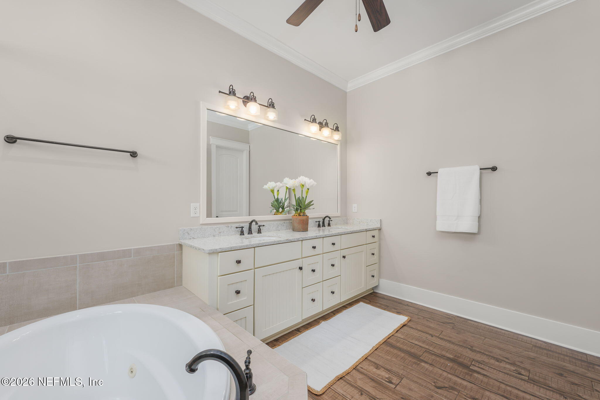 599 Timber Bridge Lane Atlantic Beach, FL 32233 - Photo 40 of 60 a spacious bathroom with a granite countertop sink a mirror and shower