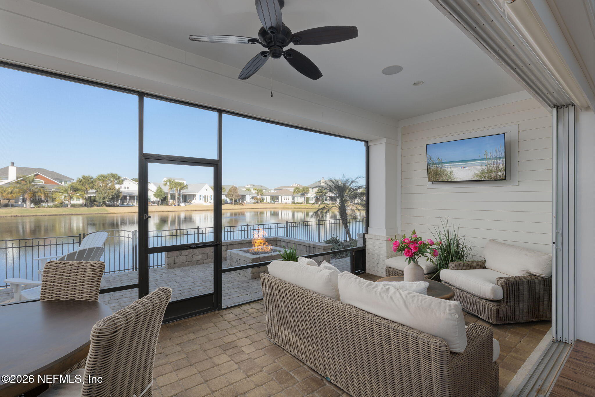 599 Timber Bridge Lane Atlantic Beach, FL 32233 - Photo 42 of 60 a living room with furniture and a floor to ceiling window