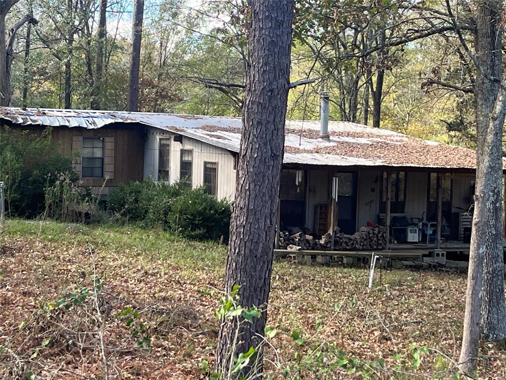 169 Pine Street Gloster, LA 71030 - Photo 2 of 2 a front view of a house with garden